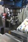 A machine that is working on a piece of metal