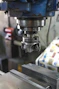 A machine that is working on a piece of metal