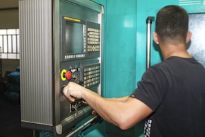 A man working on a machine in a factory