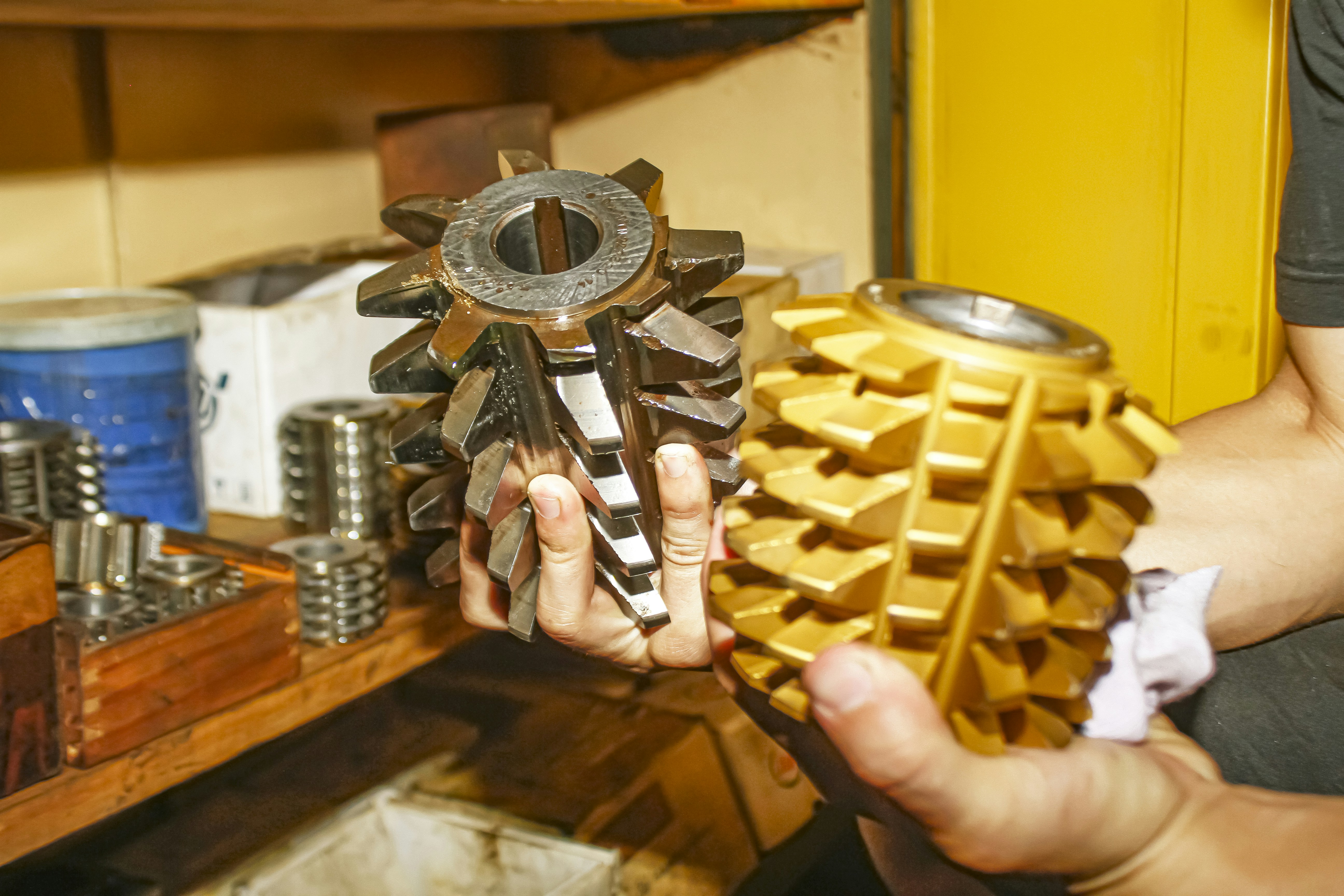 A person holding a metal object in their hands
