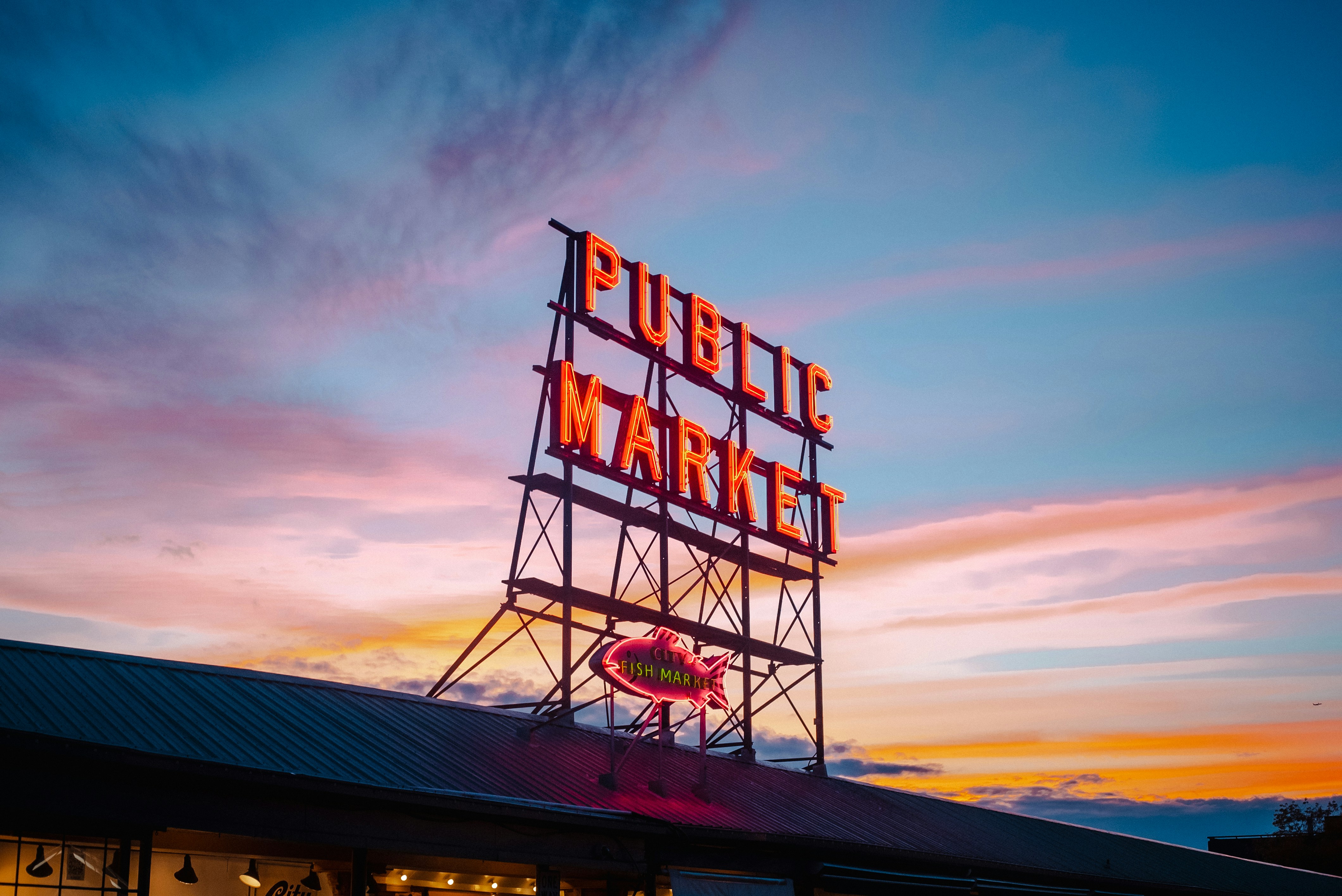 A sign that says public market on top of a building