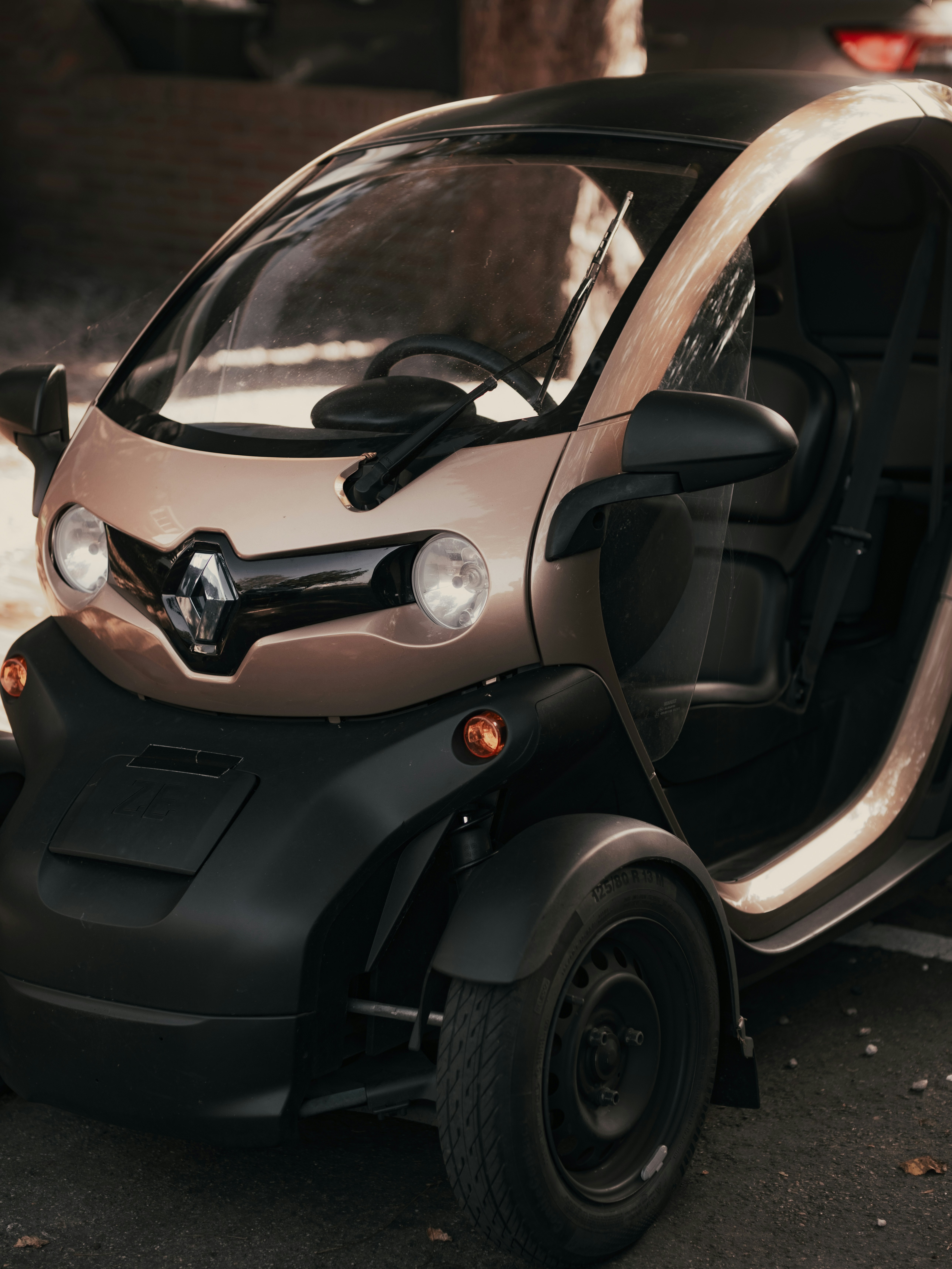 A small car parked on the side of the road