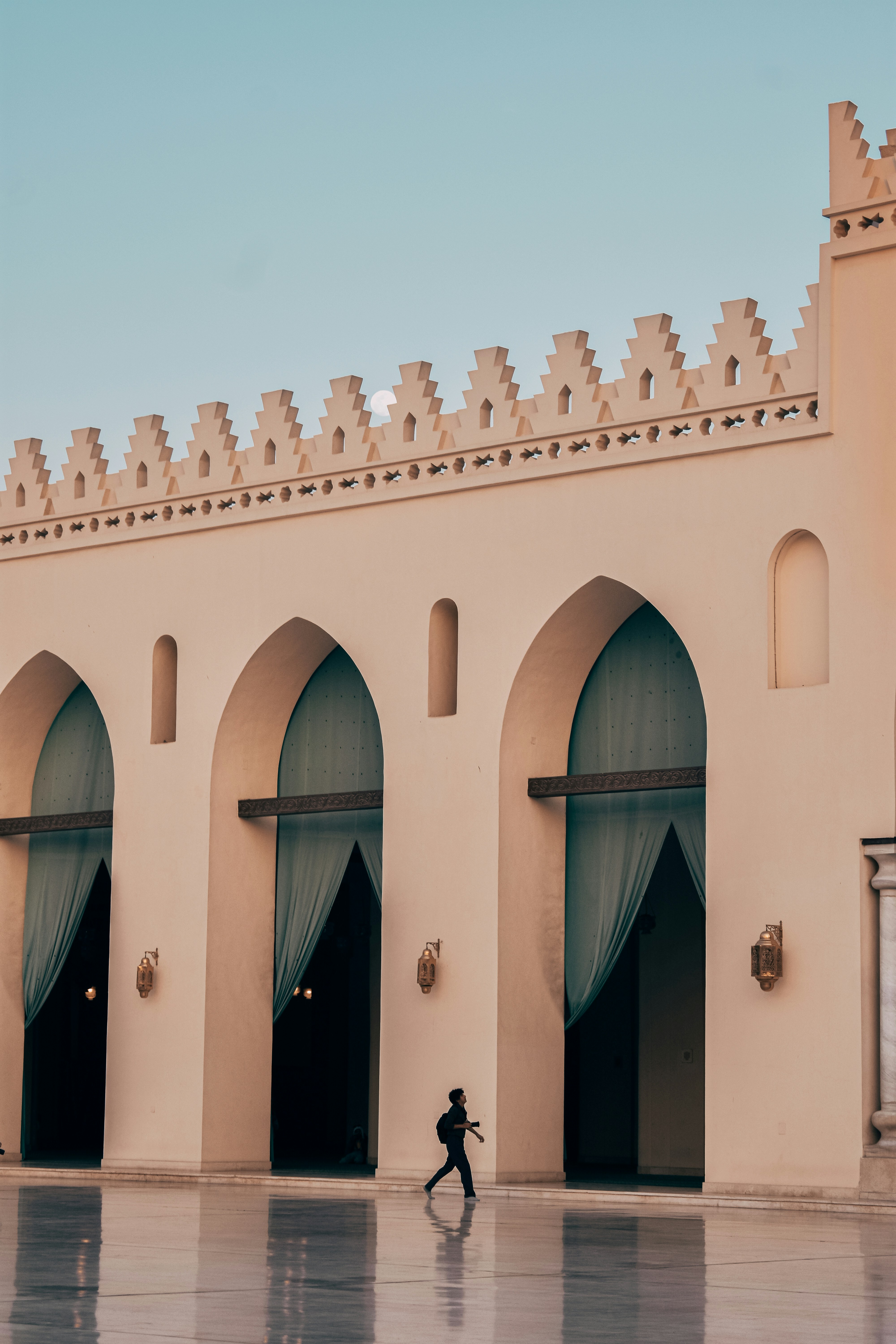 A person walking in front of a building
