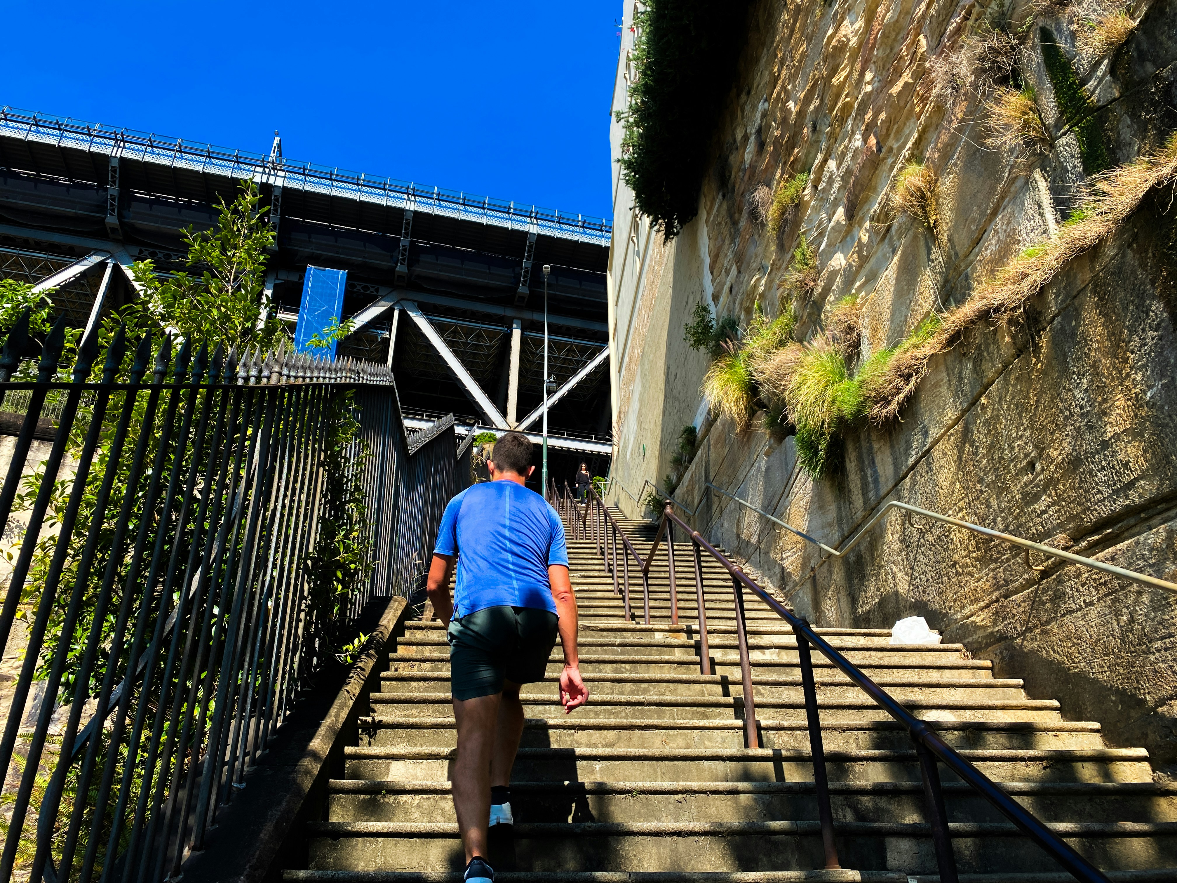 A man walking up a flight of stairs
