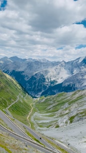 A scenic view of a winding road in the mountains