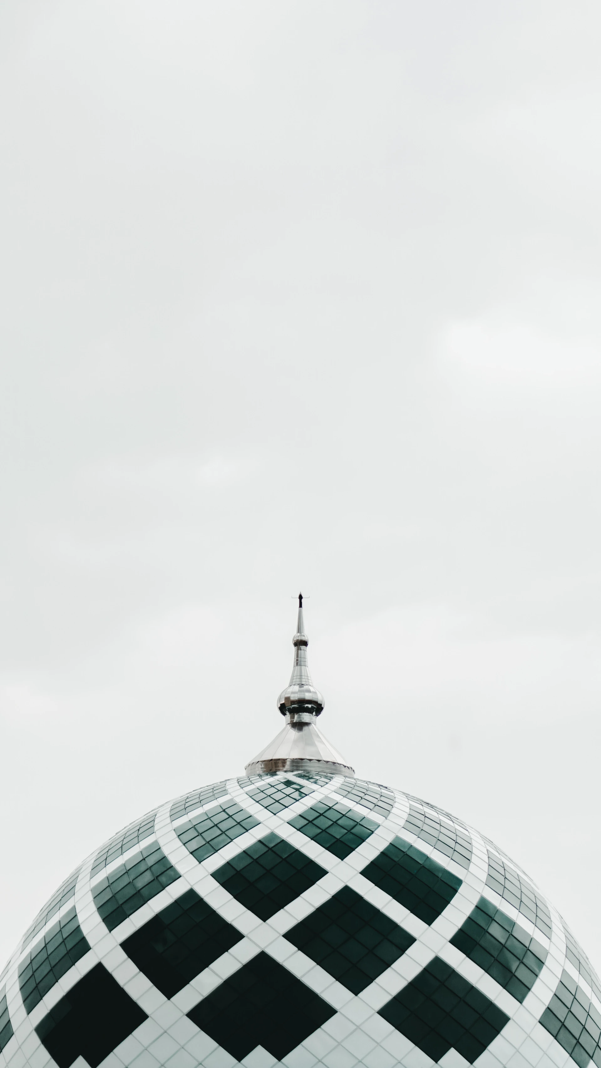 A black and white building with a clock on top