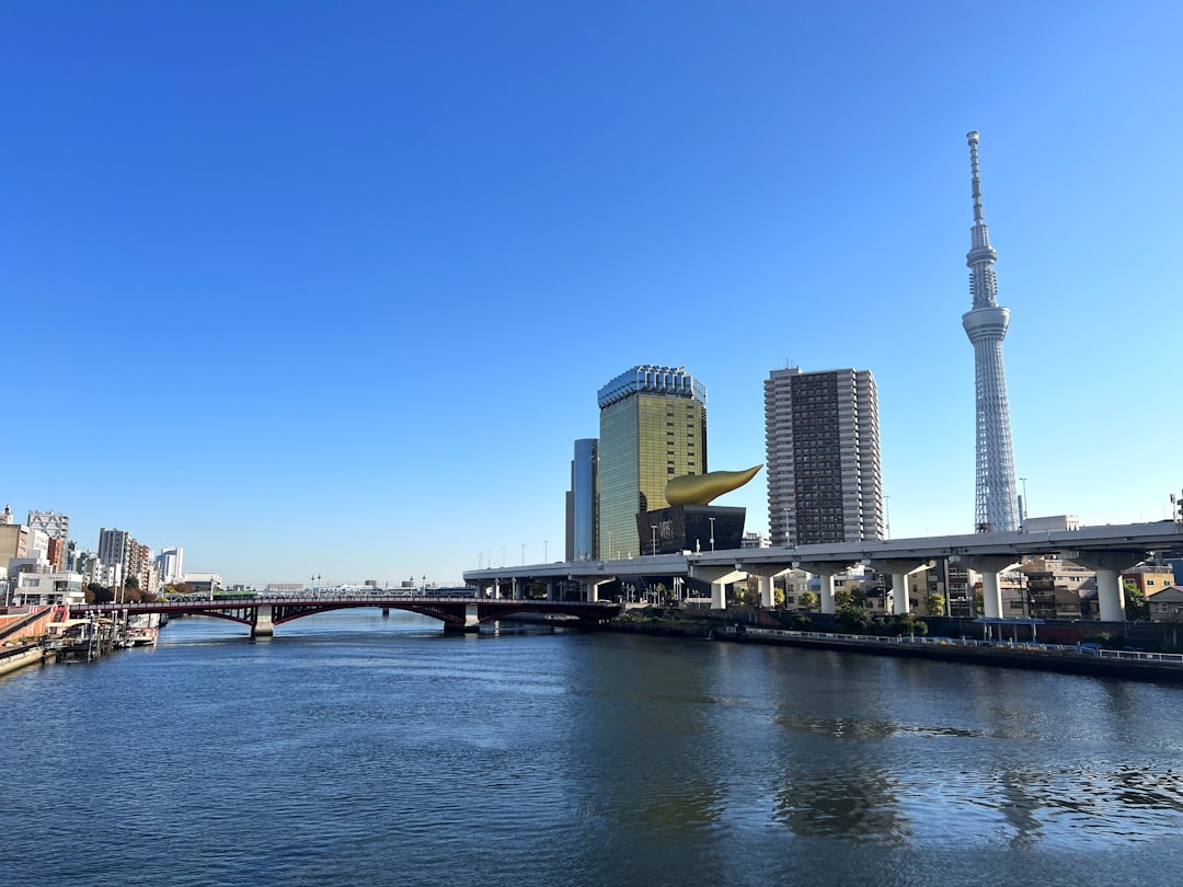A river running through a city next to tall buildings,