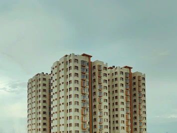 A very tall building sitting next to a body of water