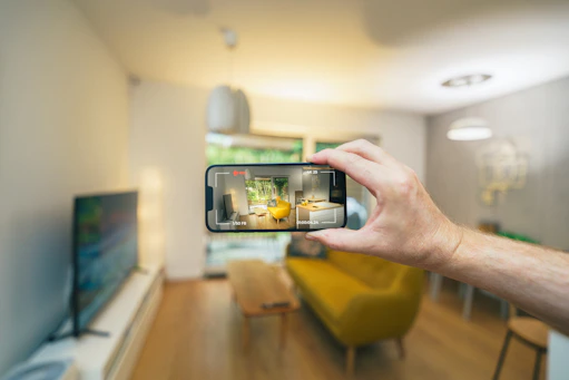 A person taking a picture of a living room