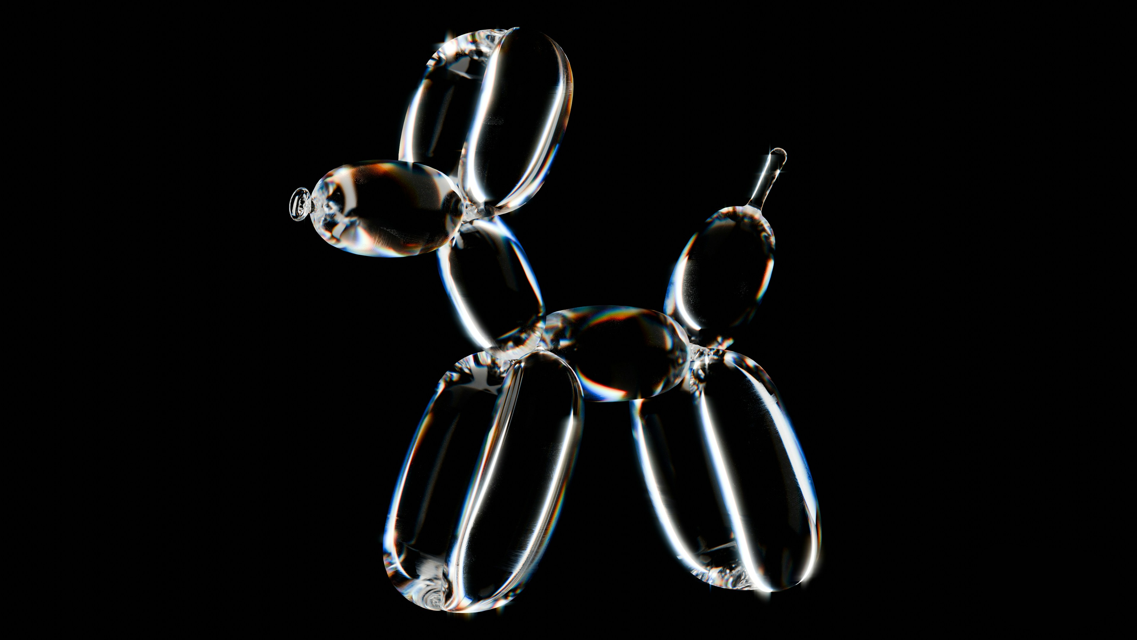 A pair of metal scissors on a black background