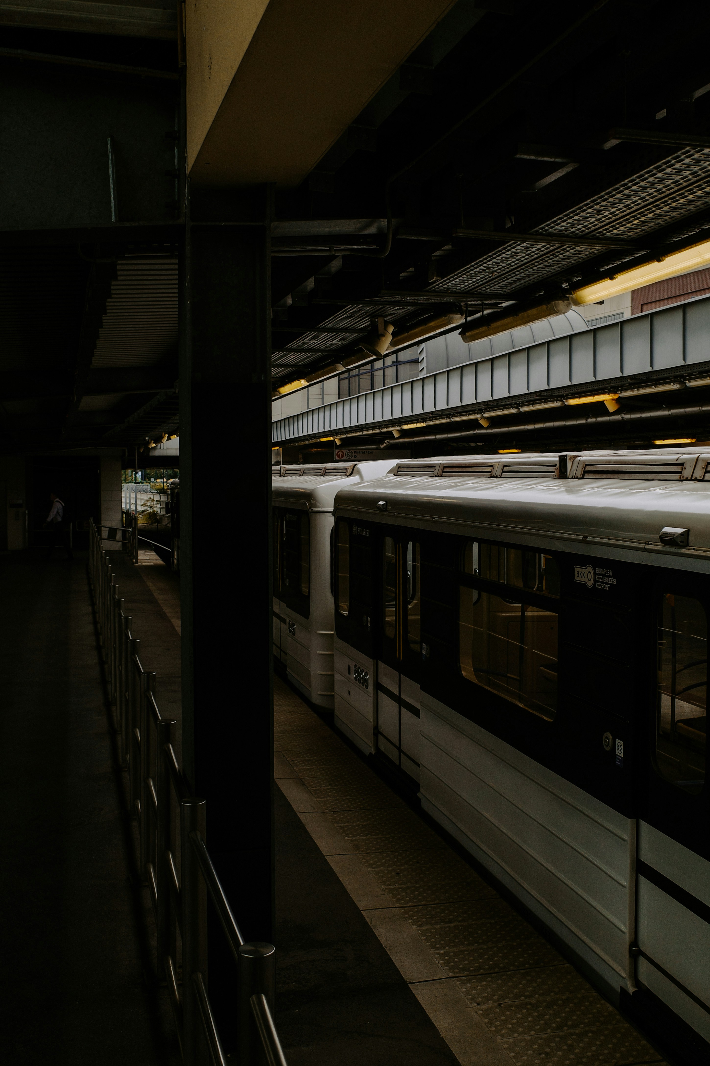 A subway train pulling into a train station