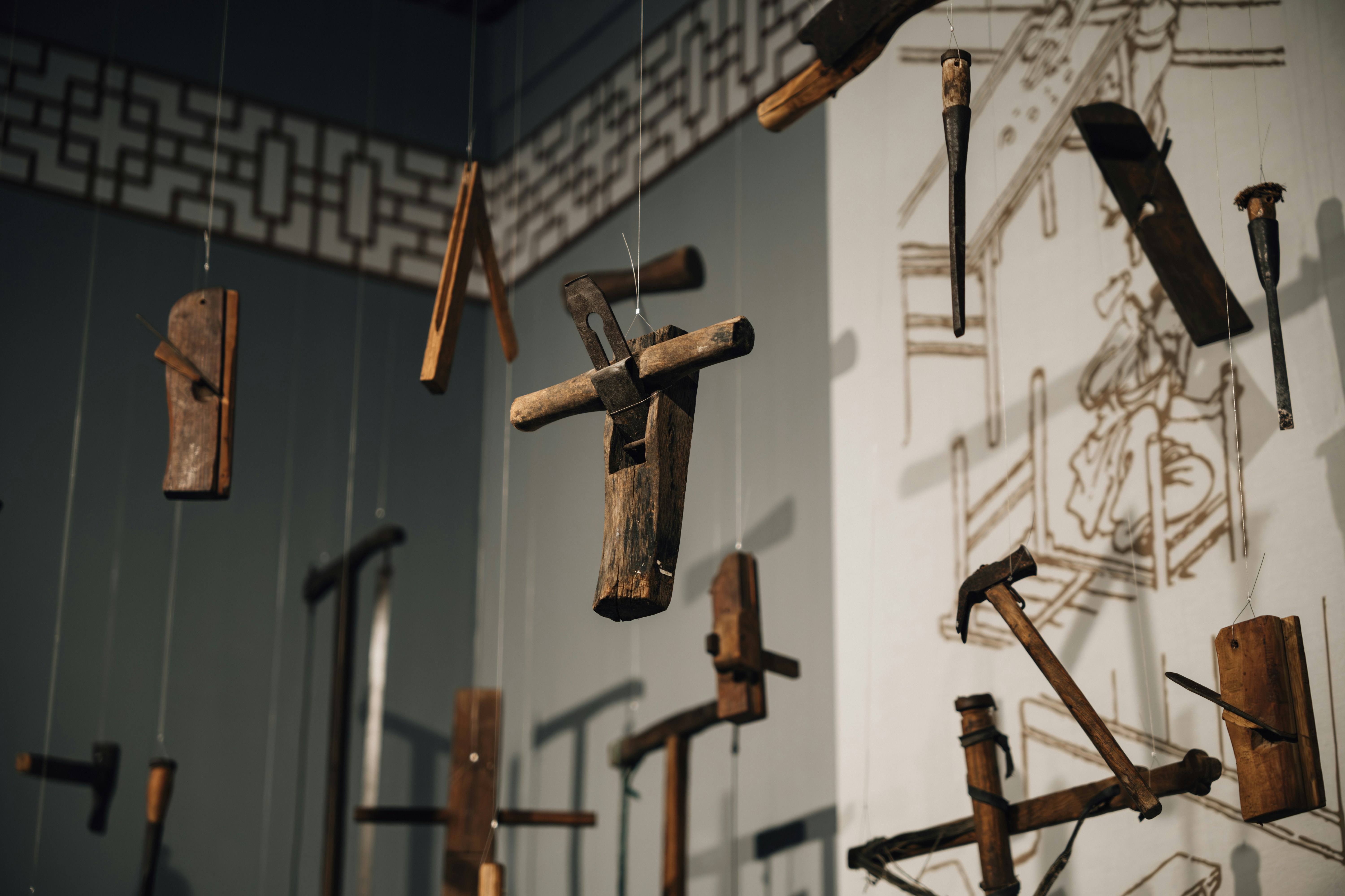 A group of wooden crosses hanging from a wall