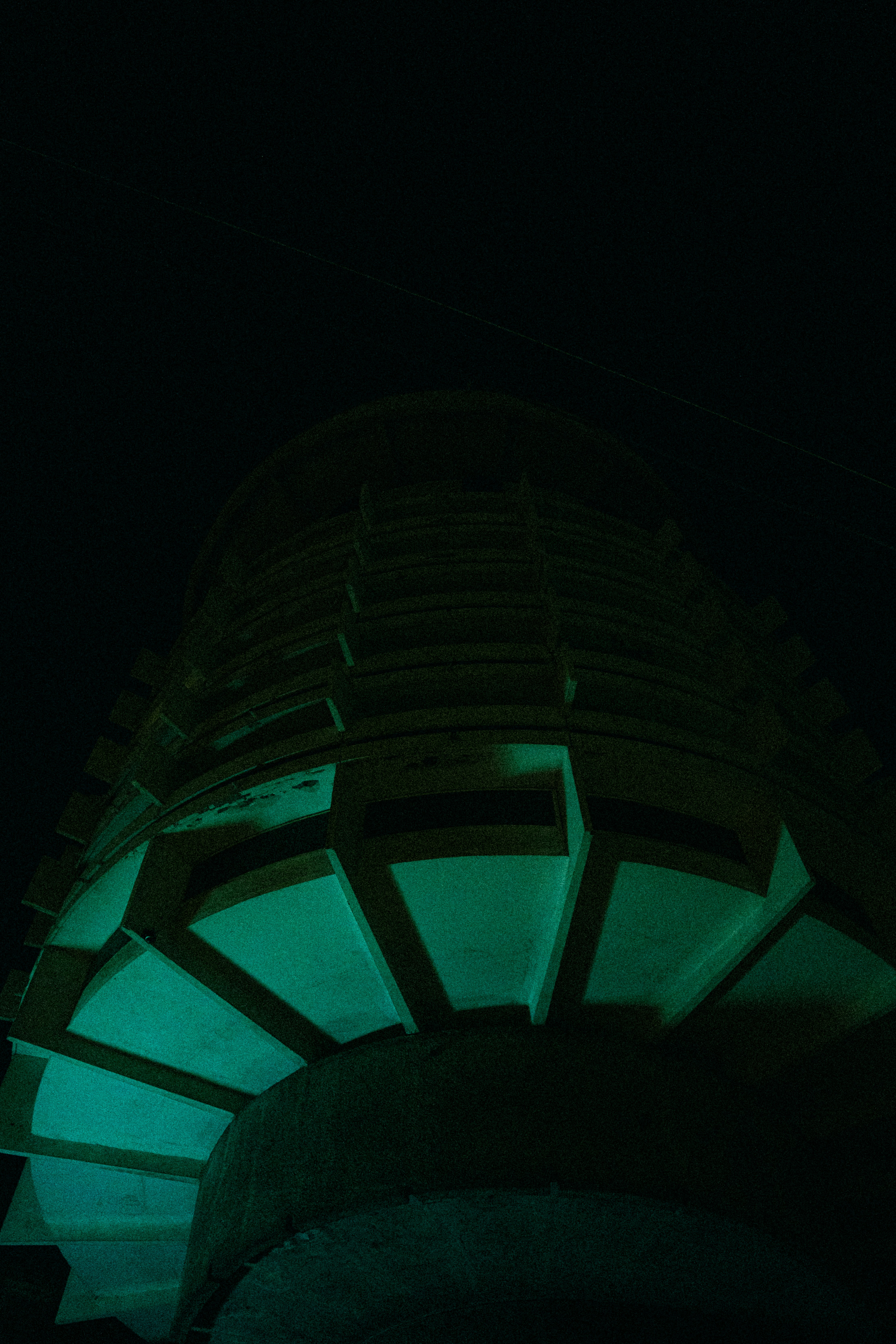 A clock tower lit up in the dark