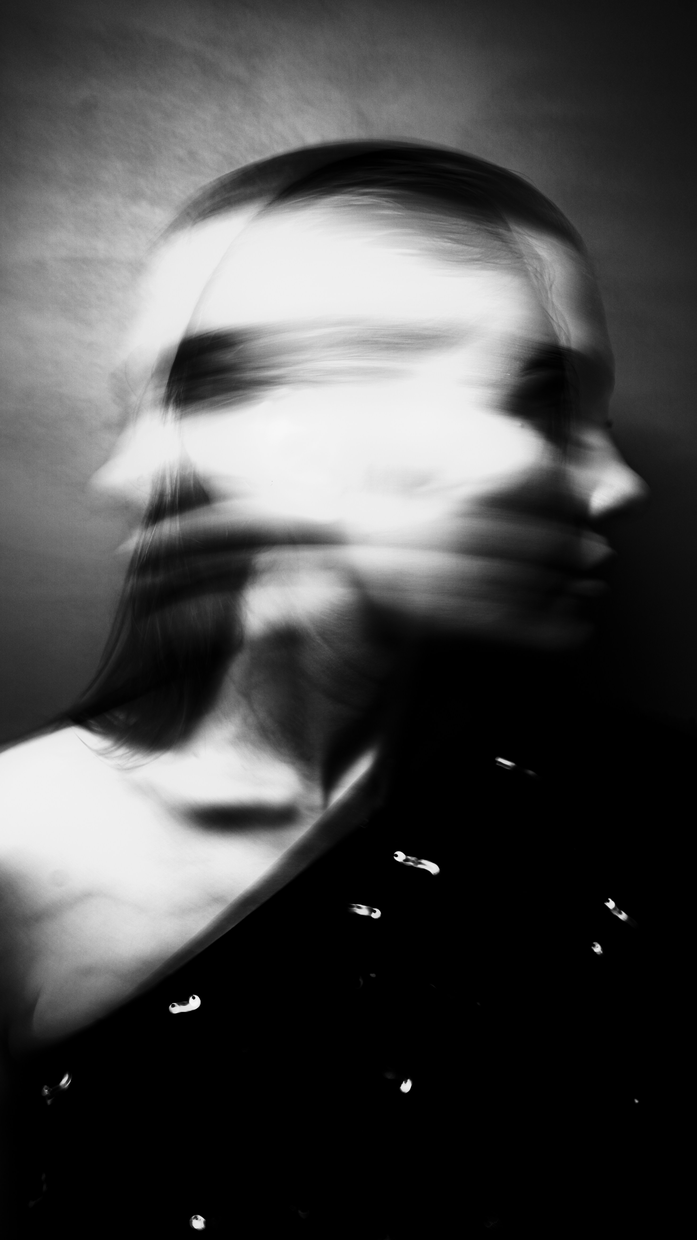 A blurry photo of a woman's face