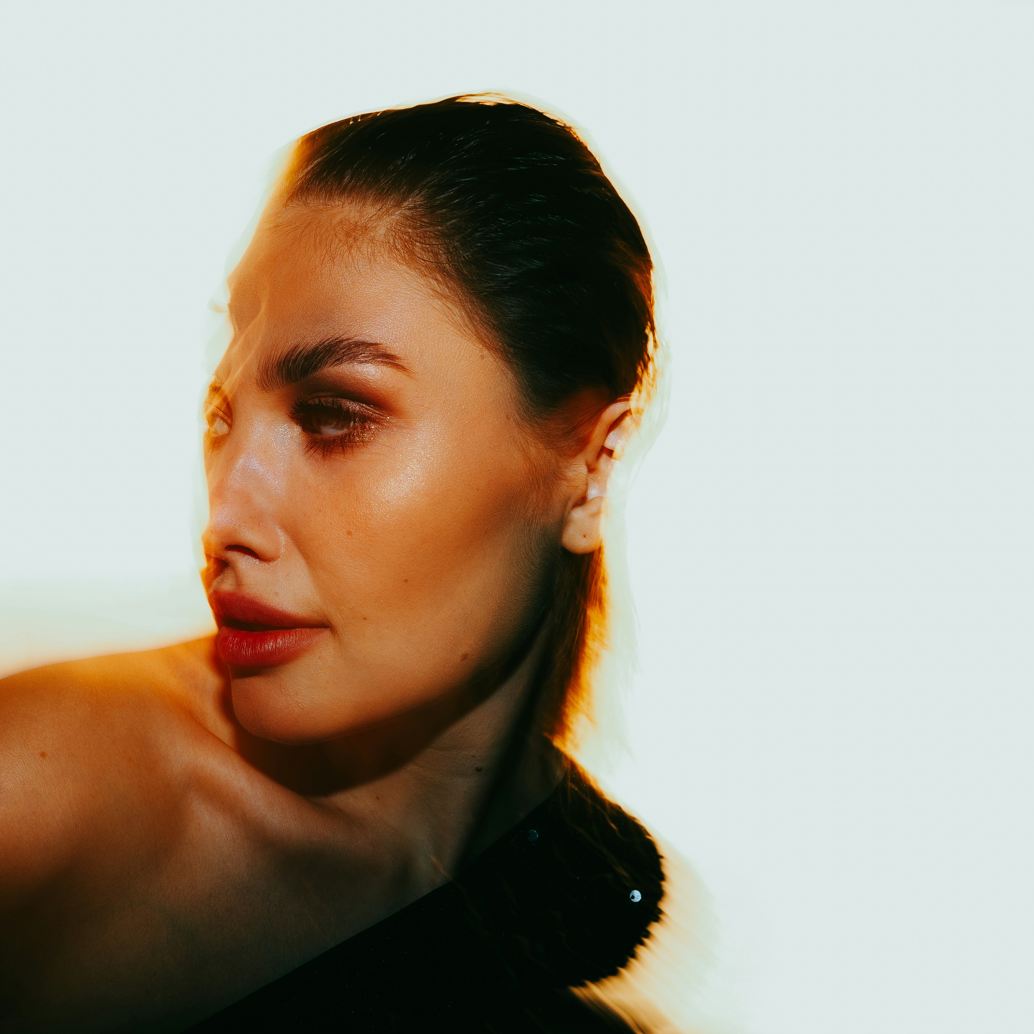 woman wearing yellow long-sleeved dress under white clouds and blue sky during daytime