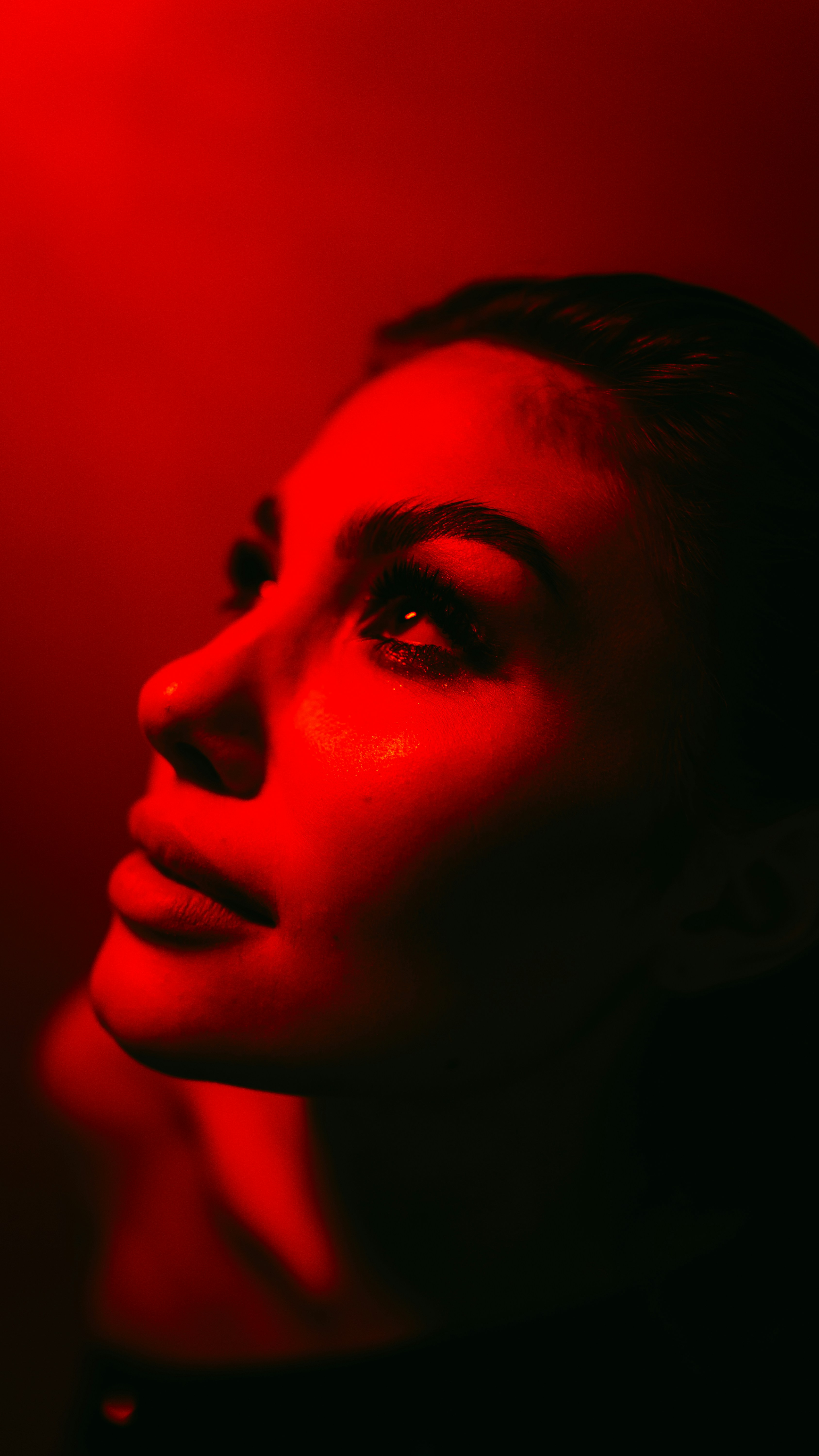 A woman with a red light on her face