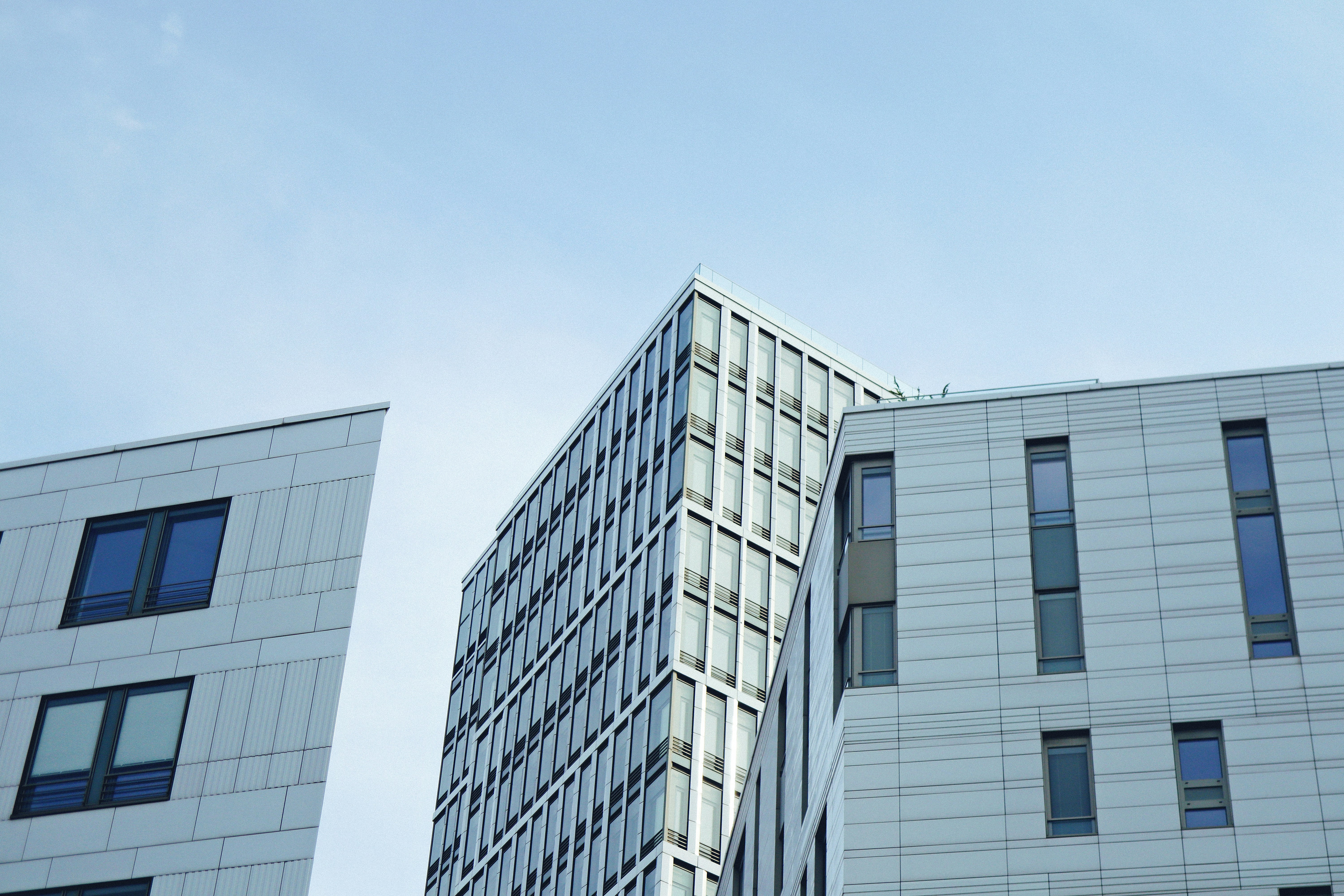 A couple of tall buildings sitting next to each other