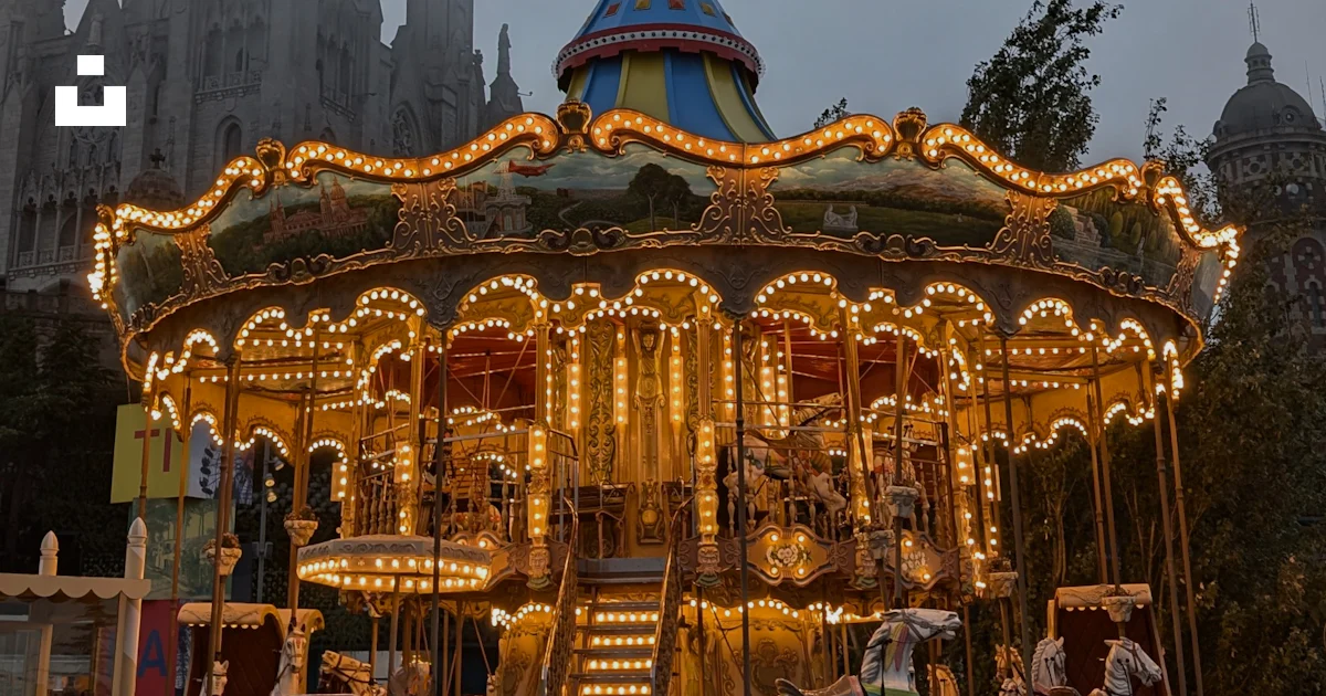 Merigo Rounf Front A merry go round in front of a castle photo – Free Spain Image on Unsplash