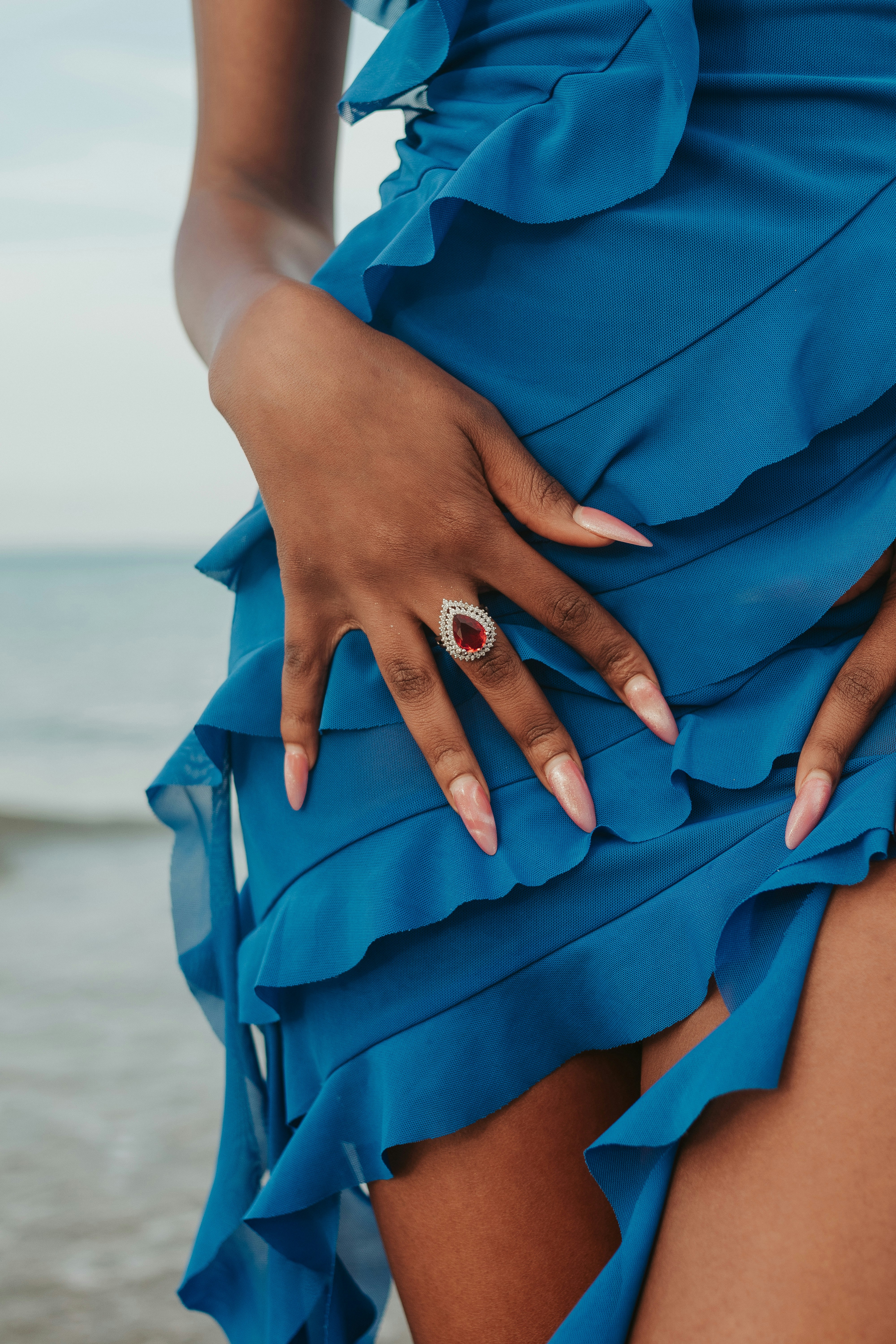A woman in a blue dress with her hands on her hips photo – Free Fashion ...