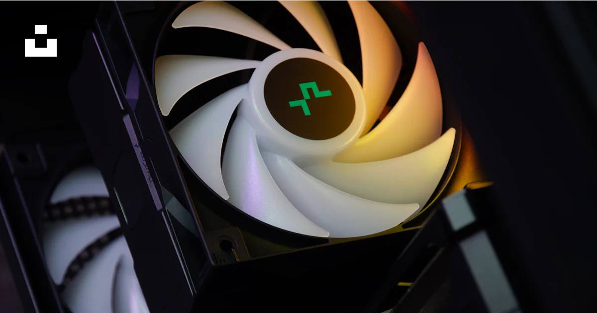 A close up of a computer fan in a dark room photo – Free Hardware Image ...