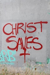 A wall that has some graffiti on it