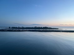 A body of water with a small island in the distance
