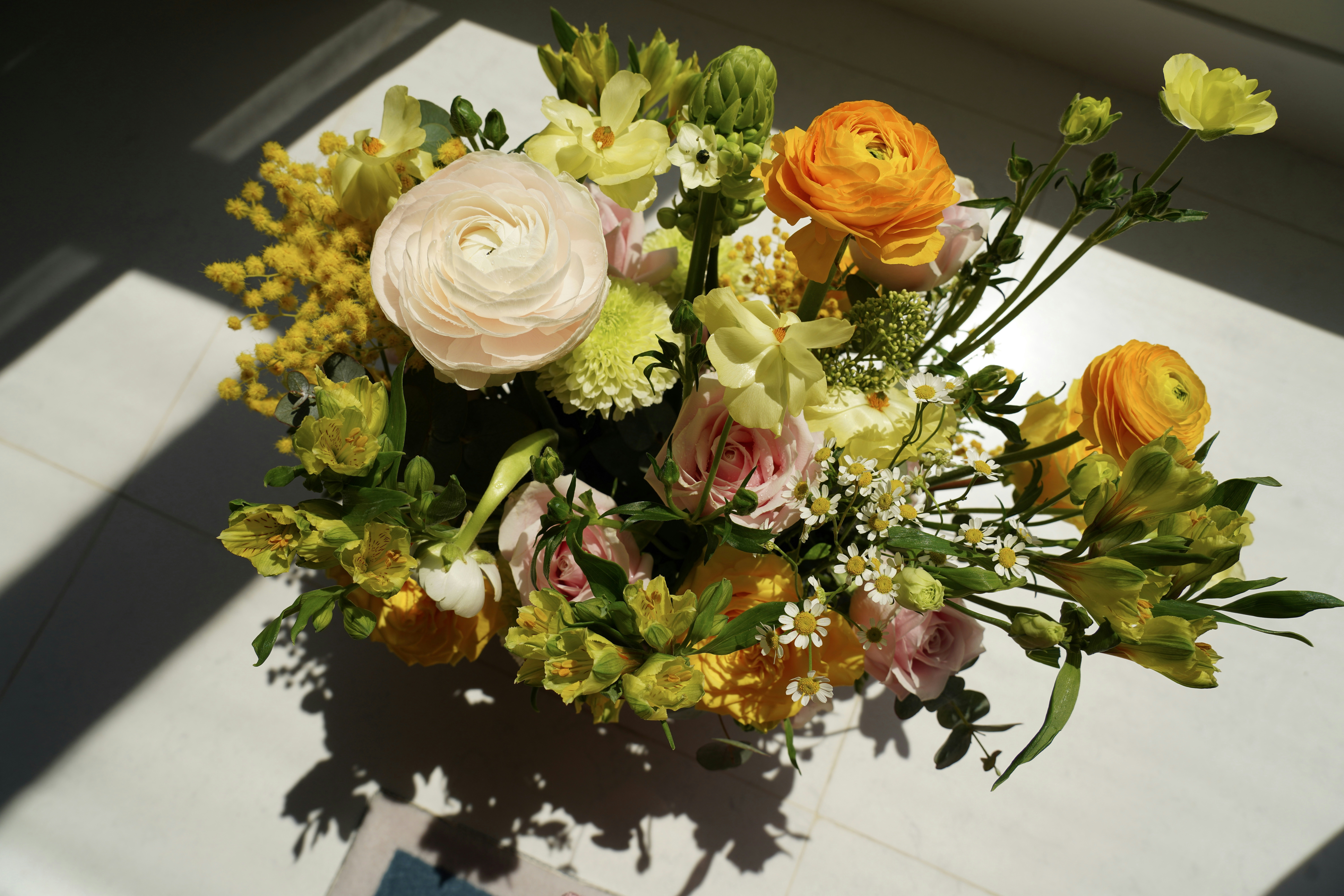 A bouquet of flowers sitting on top of a table