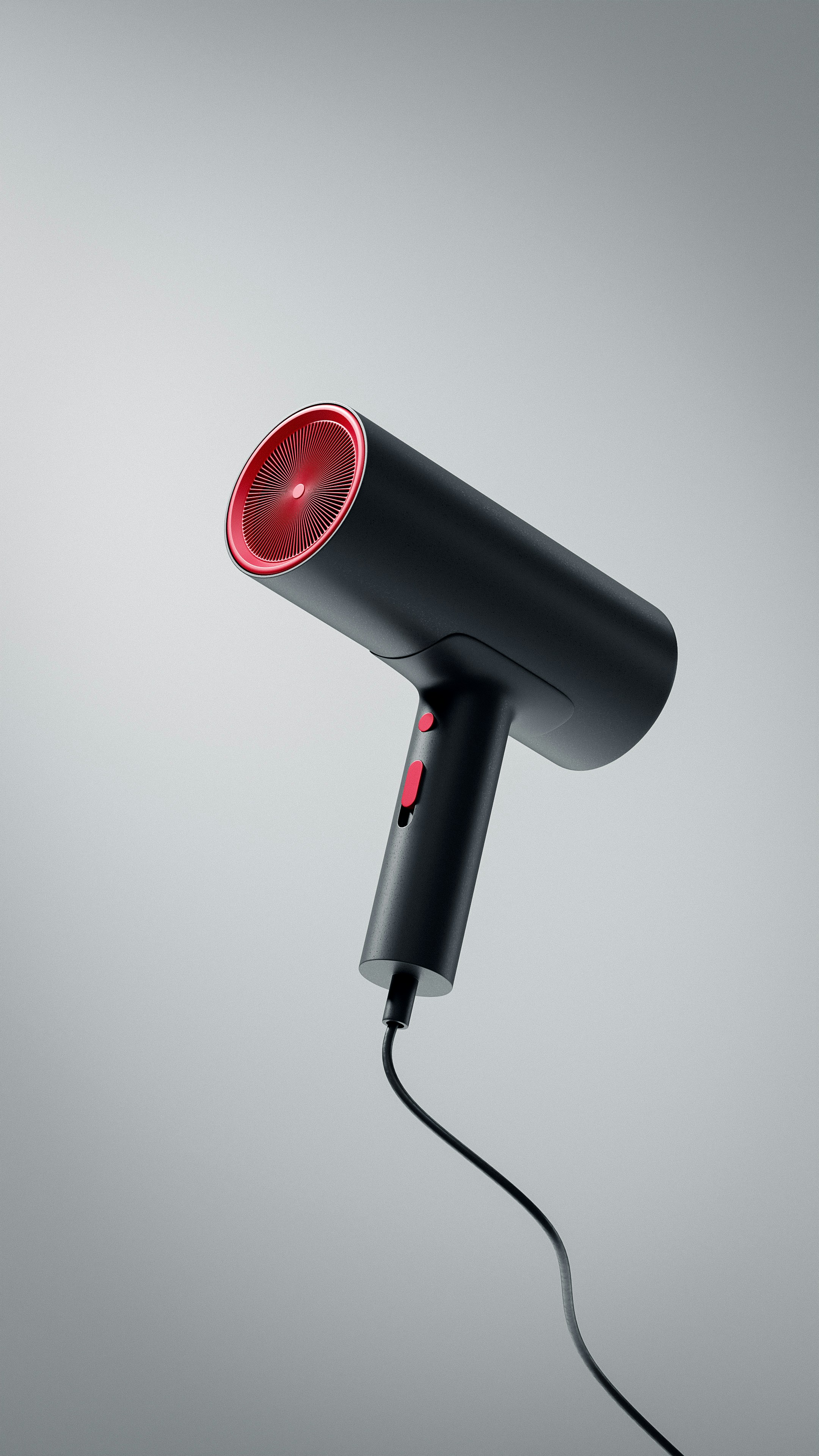 A black hair dryer with a red light on it