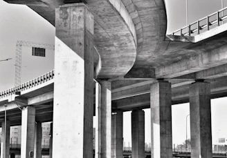 A black and white photo of a highway overpass