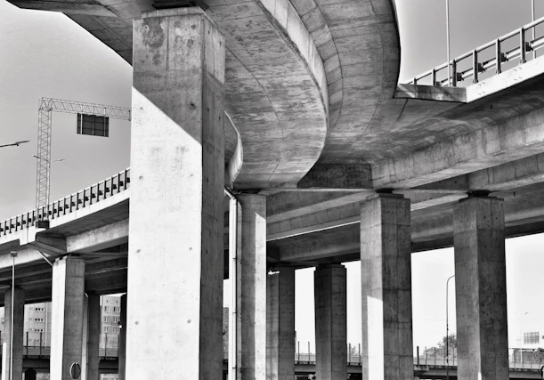 A black and white photo of a highway overpass