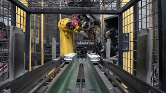 A machine is moving a conveyor belt in a factory