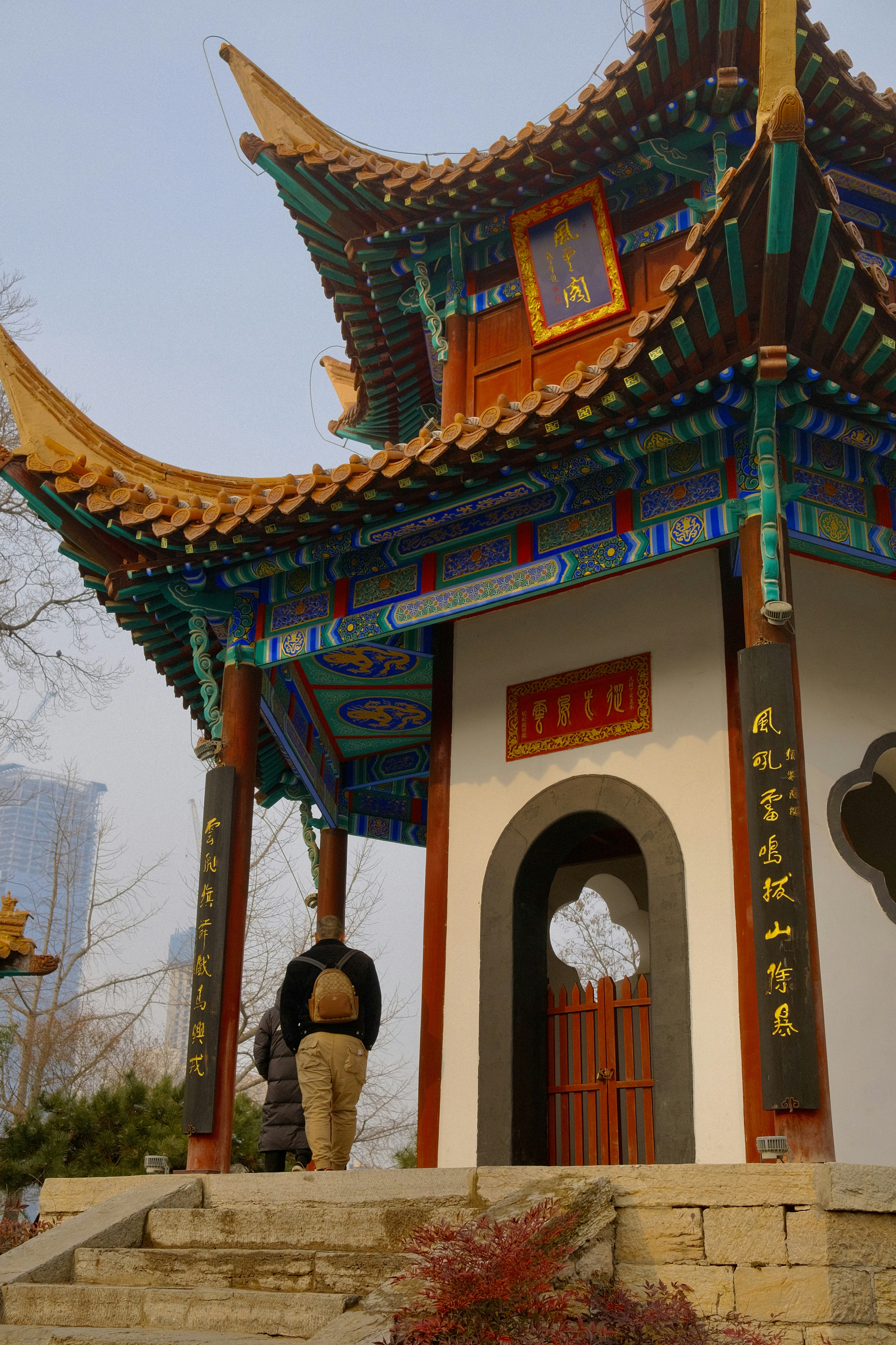 A person standing in front of a building