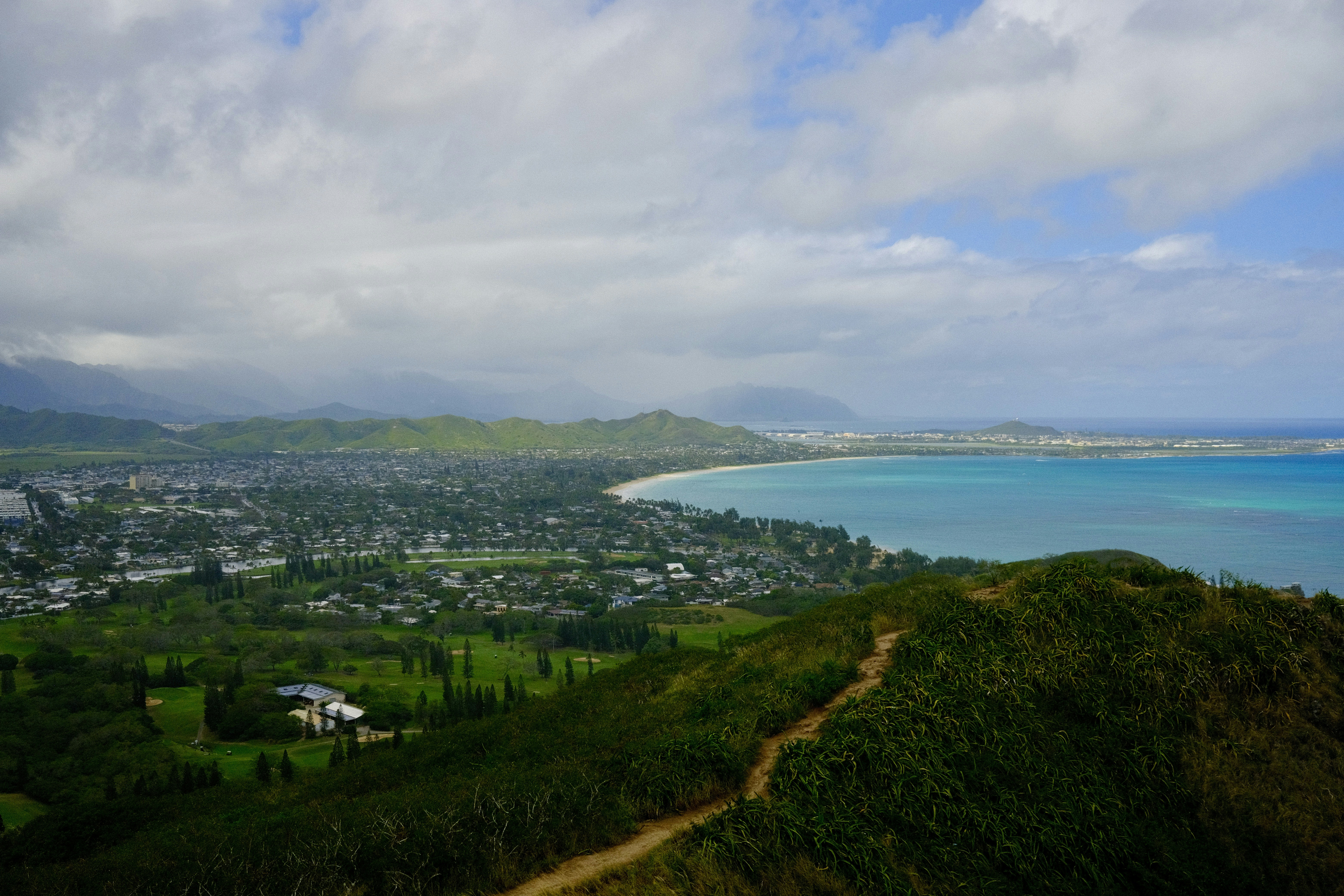 A scenic view of a city and the ocean