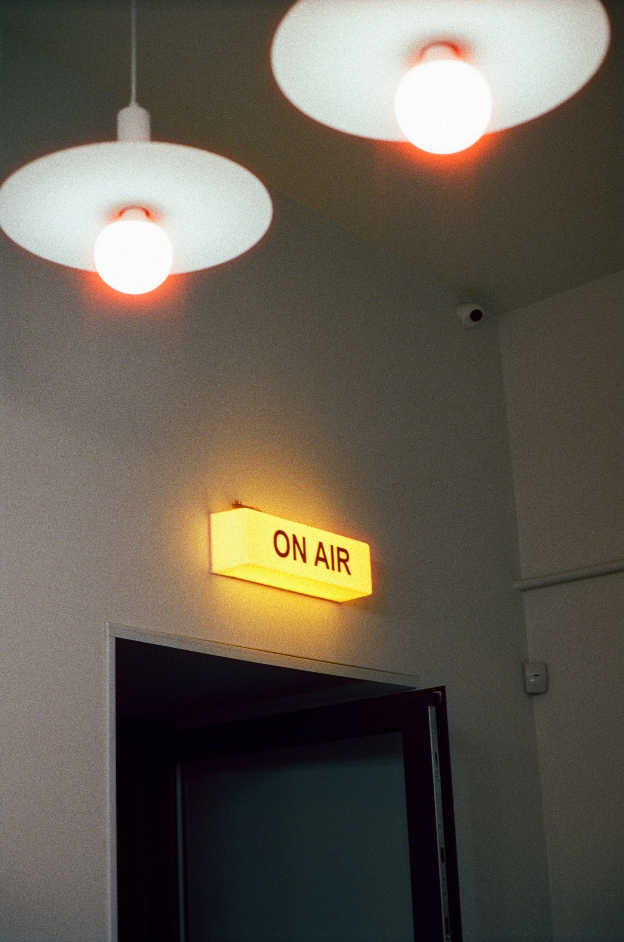 A couple of lights that are above a door