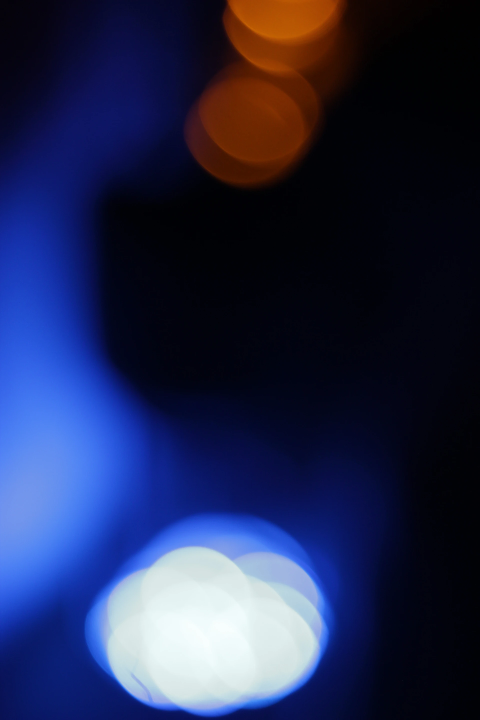 A blurry photo of a street light at night