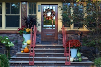 A couple of red chairs sitting on top of a set of steps