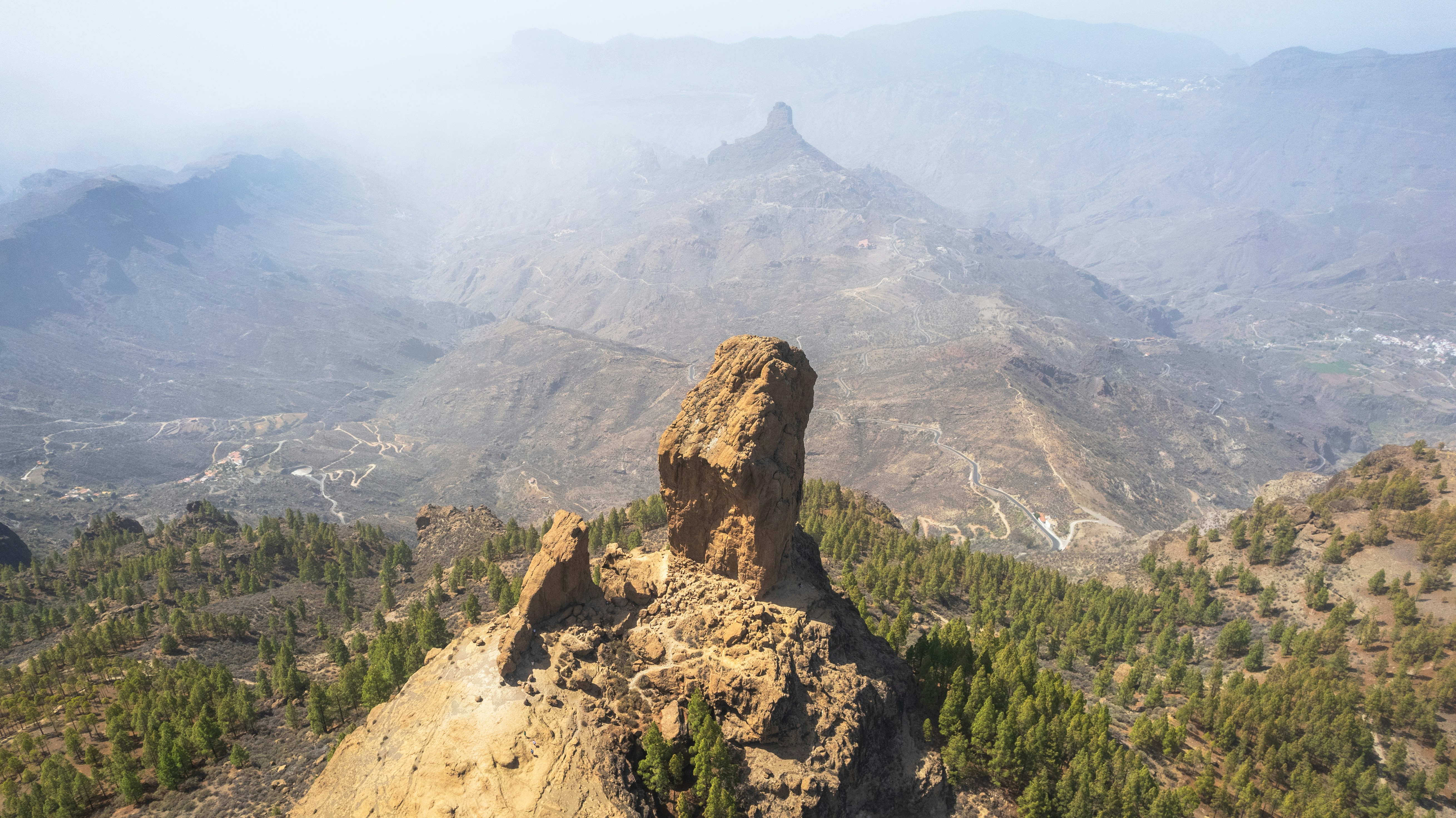 A rocky outcropping in the middle of a mountain range
