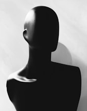 A black and white photo of a mannequin's head