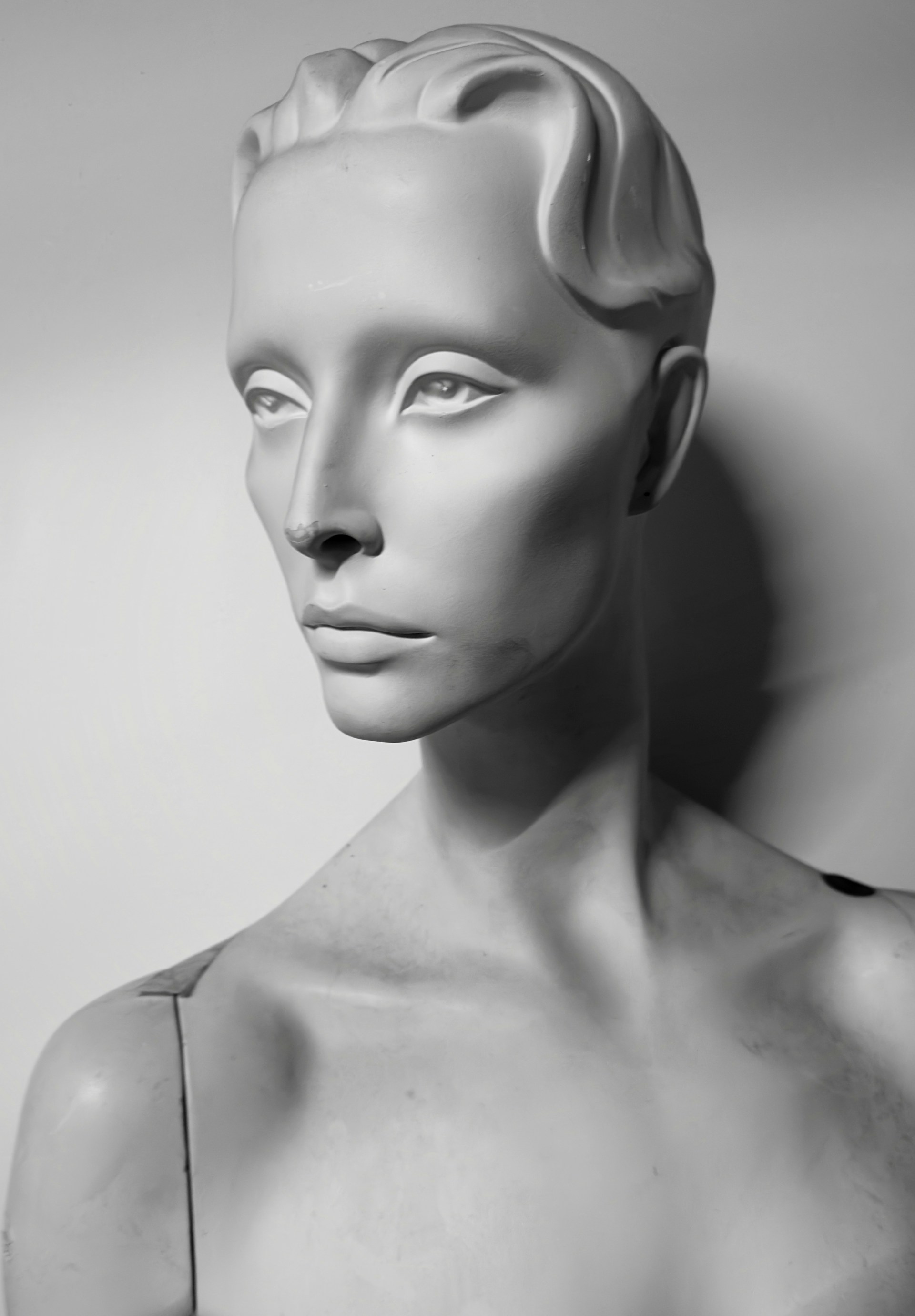 A black and white photo of a mannequin head