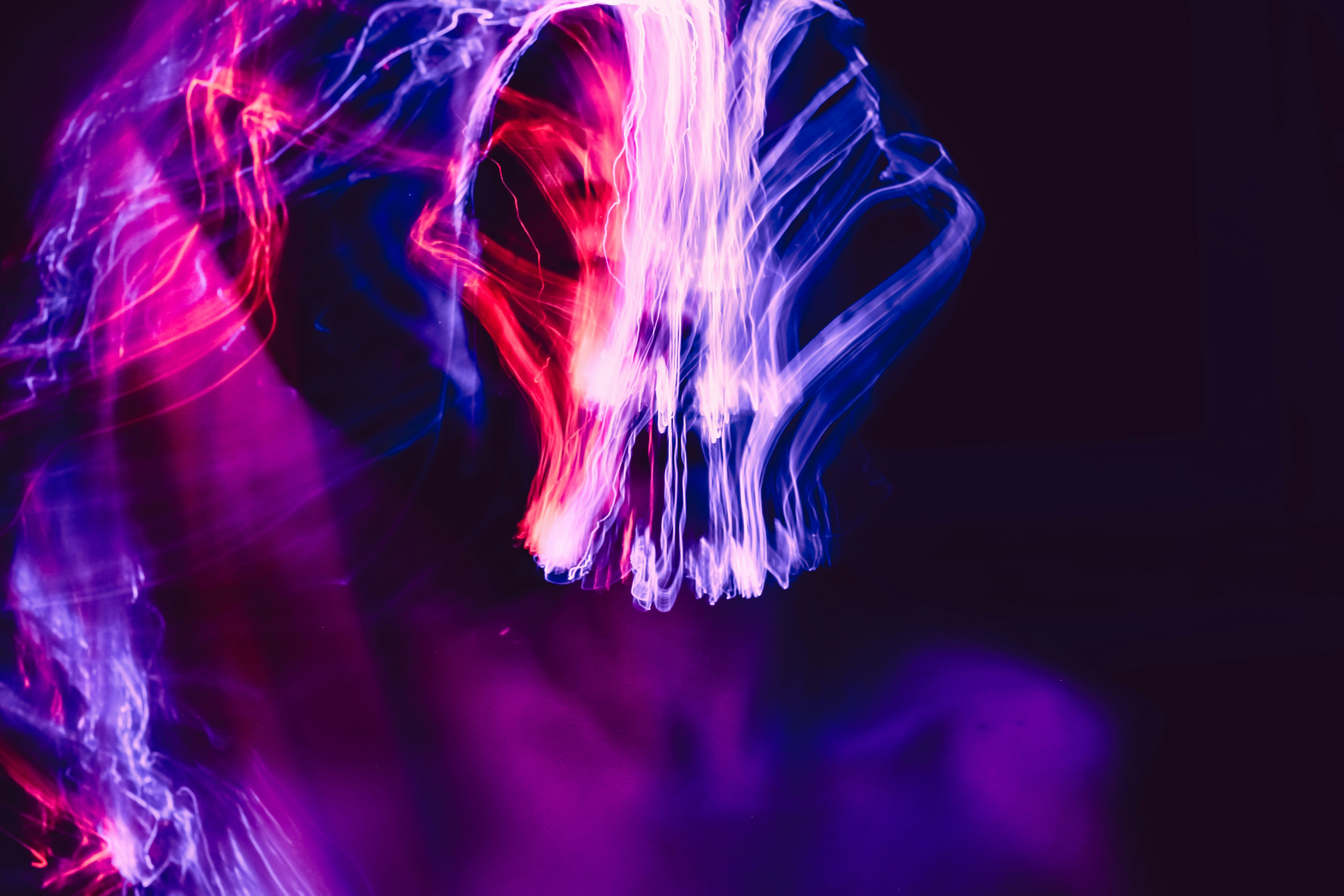 A blurry photo of a person's face and hands