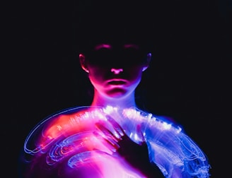 A woman in a white dress with neon lights on her body
