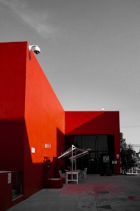 A black and white photo of a red building