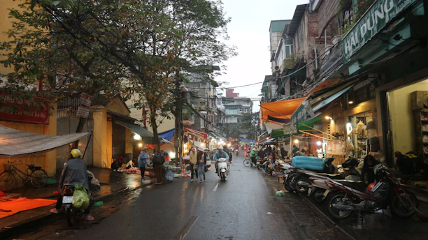 A group of people riding motorcycles down a street
