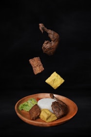 A brown plate topped with different types of food