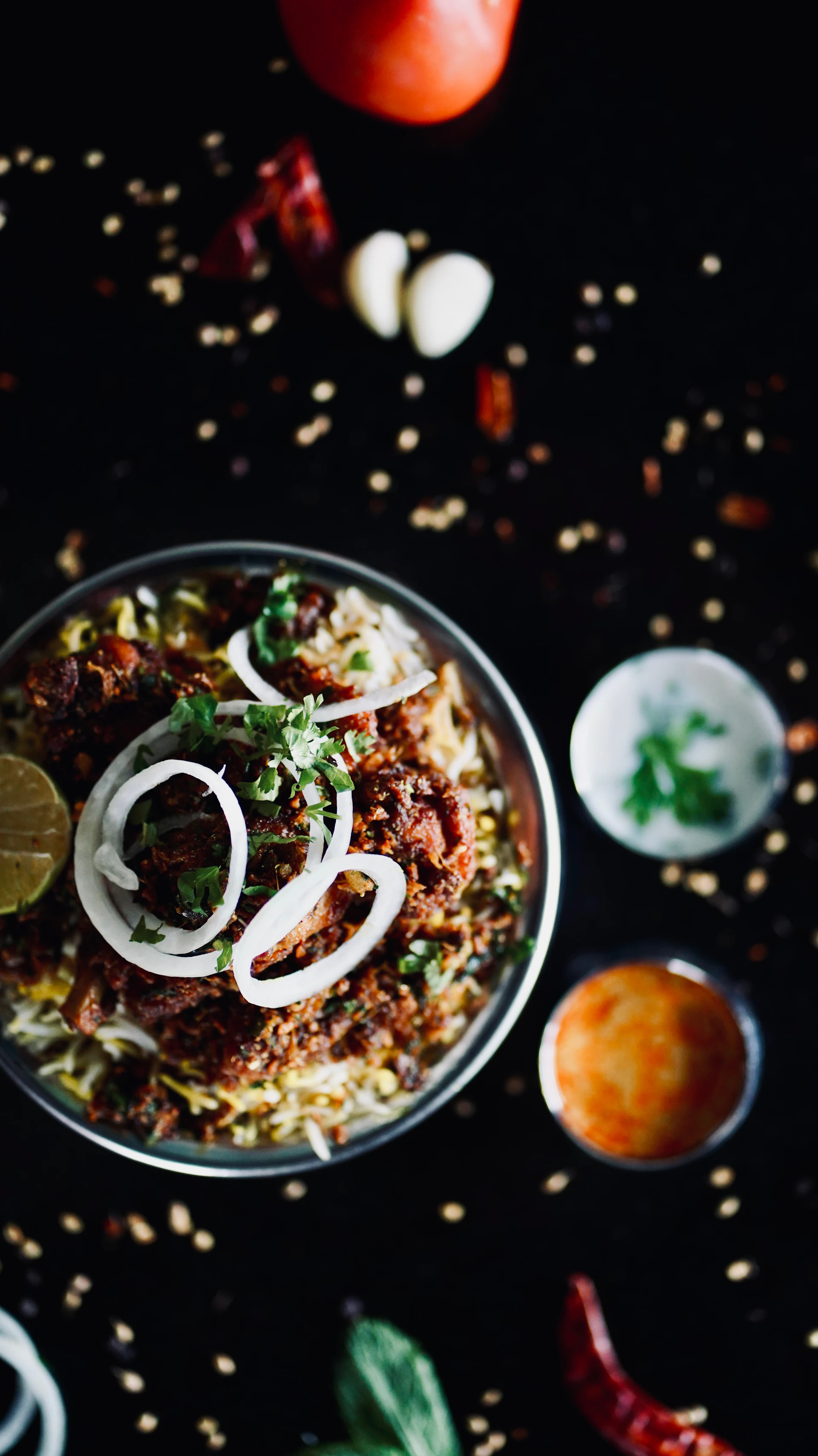 A bowl of food with onions and onions