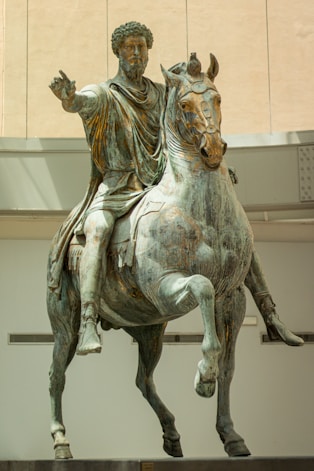 A statue of a man riding on the back of a horse