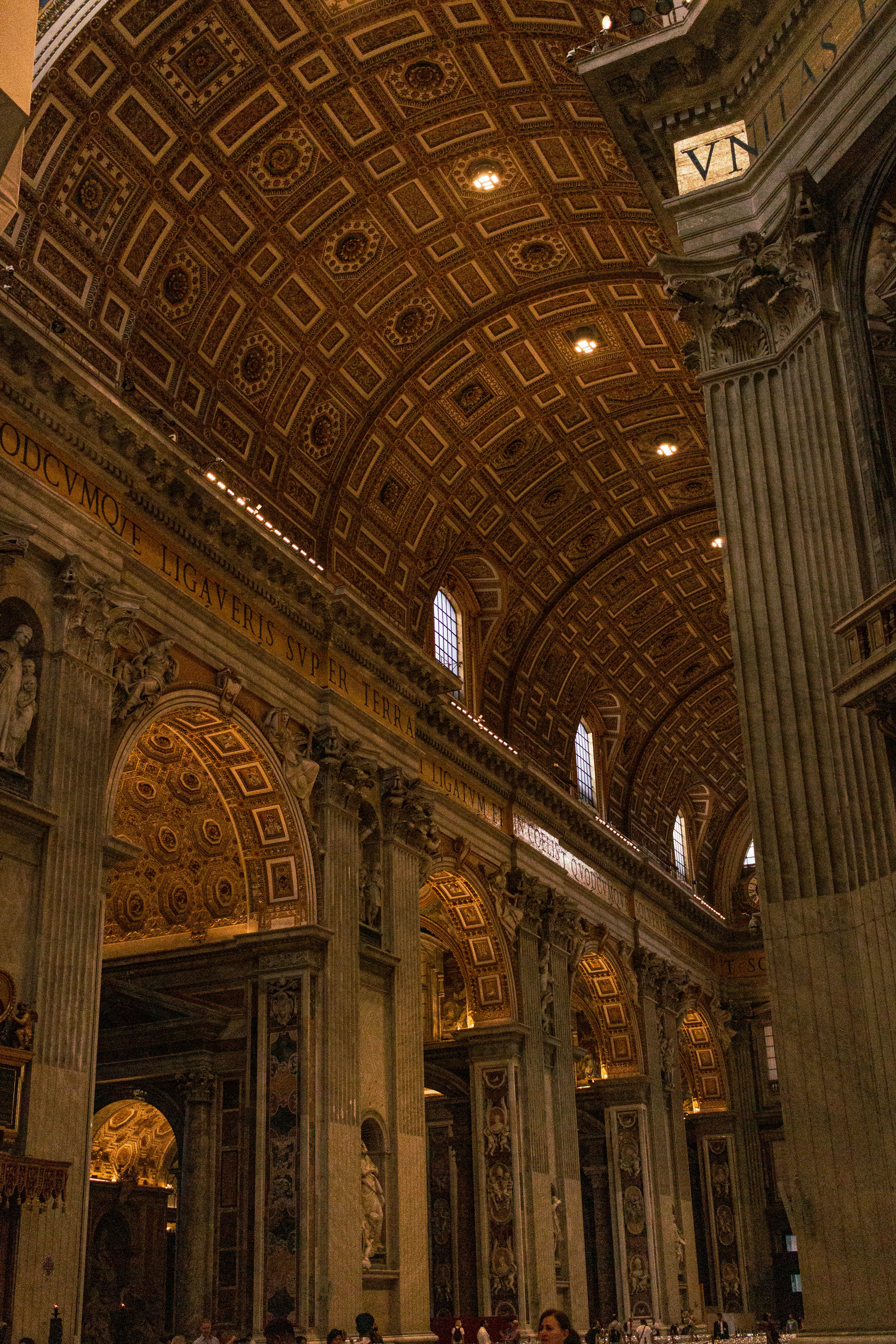 A large cathedral with a clock on the ceiling
