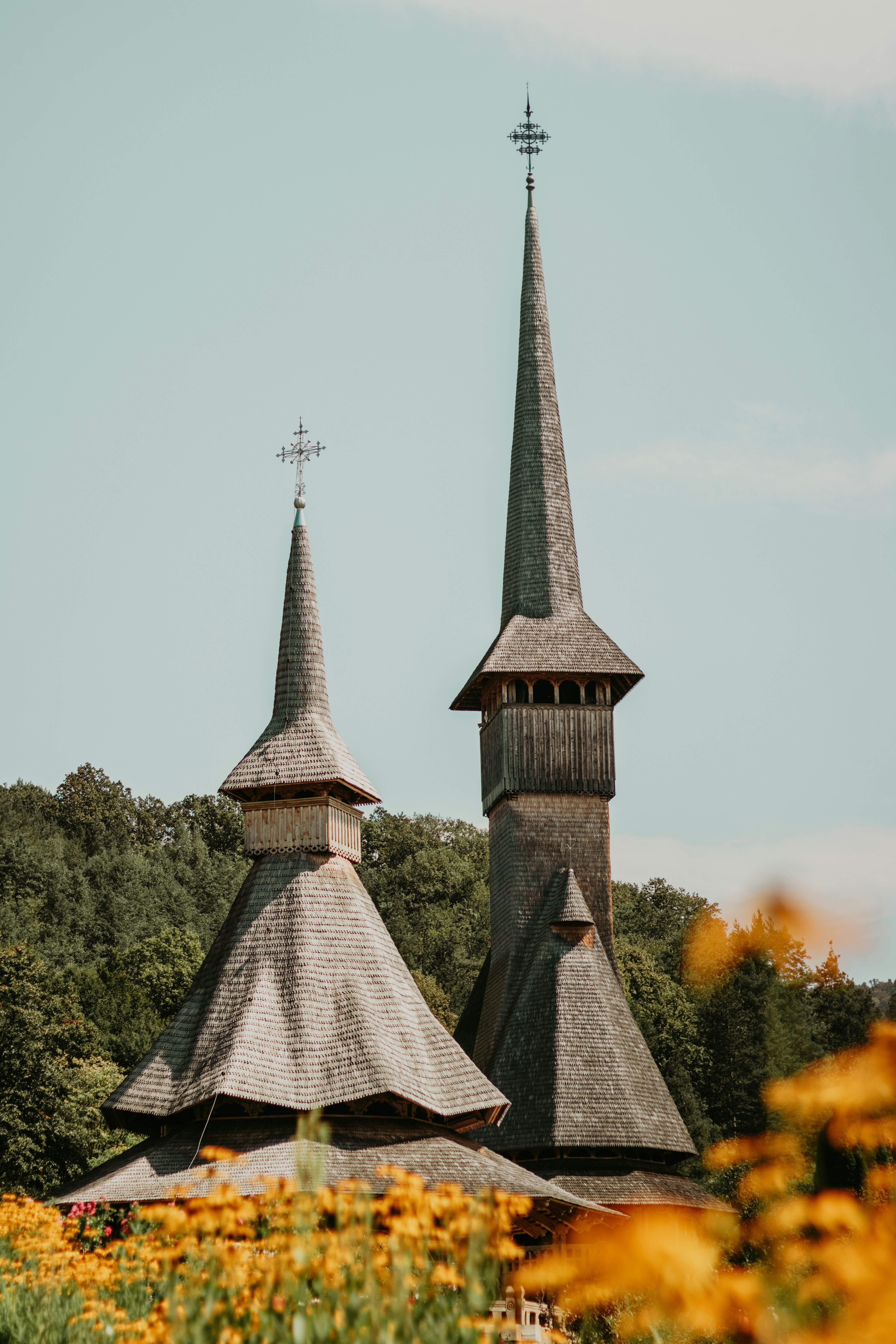 A church with two steeples and a clock tower