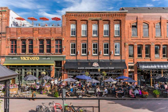 A large group of people sitting outside of a building