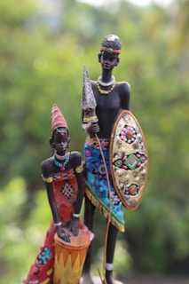 A couple of figurines sitting on top of a table